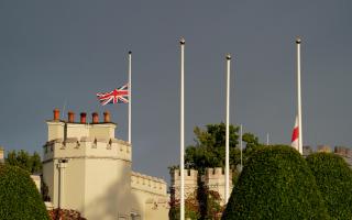 Flags were flying at half mast at Wentworth yesterday, where the opening round of the PGA Championship was halted following the death of the Queen