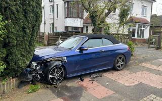 Delays on road after 'car collides into house'