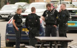 Armed police and air ambulance attend college amid incident