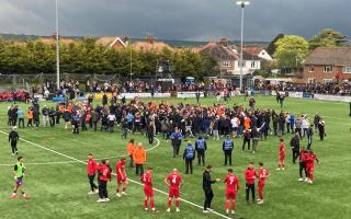 Worthing players can only watch as Braintree celebrate promotion