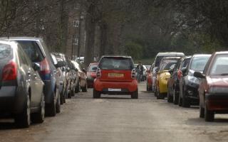 Cars parked in Preston Park Avenue, Brighton