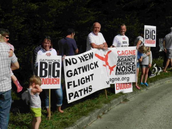 Protesters gather to oppose new flight paths for Gatwick Airport at the Tour of Britain