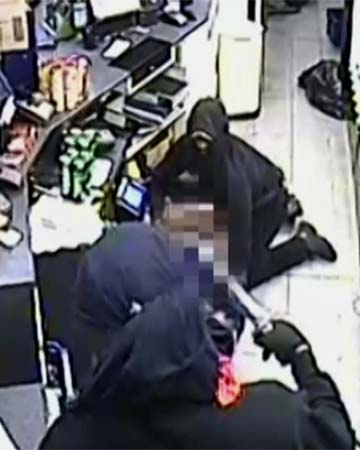 WARNING shocking CCTV: Petrol station robbed by attackers with Samurai sword