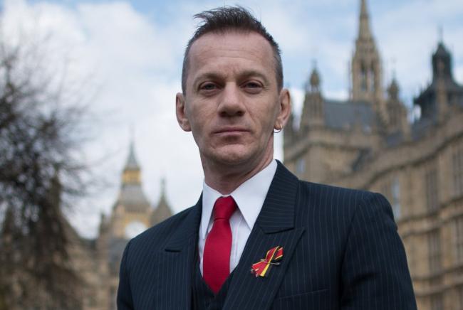 Blood transfusion scandal victim Mark Ward outside the Houses of Parliament in London