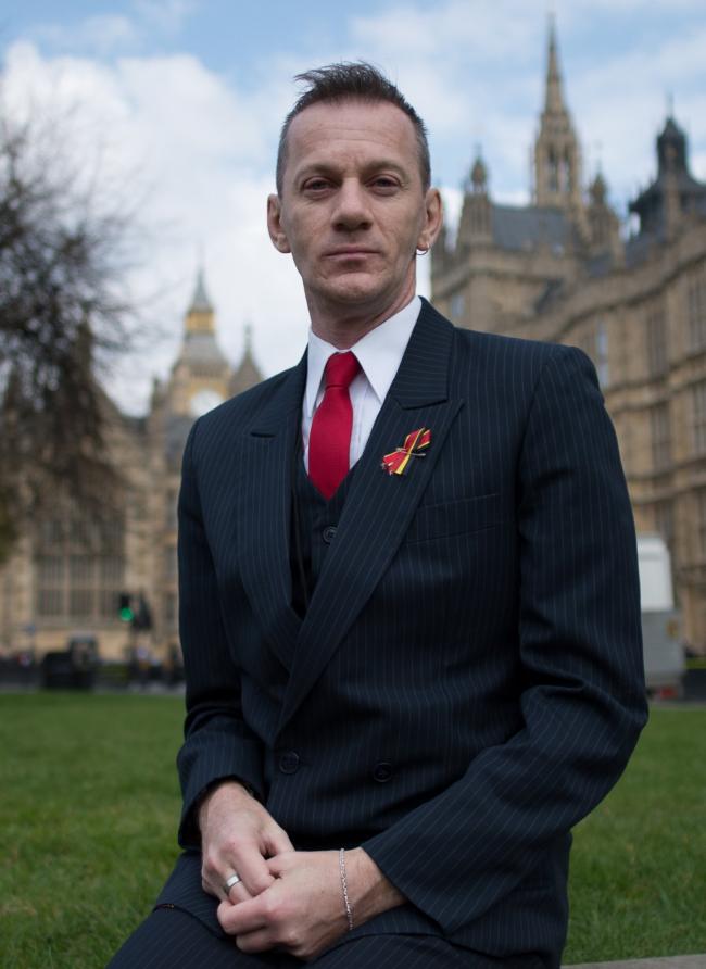 Mark Ward outside the Houses of Parliament in London today and meeting Brighton MP Caroline Lucas. Stefan Rousseau/PA..