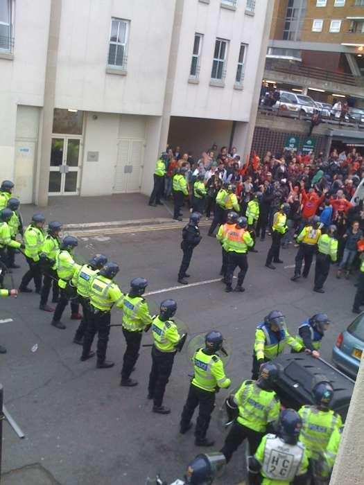 Police form lines ahead of a standoff in Trafalgar Street this afternoon. Picture by James Devonport.