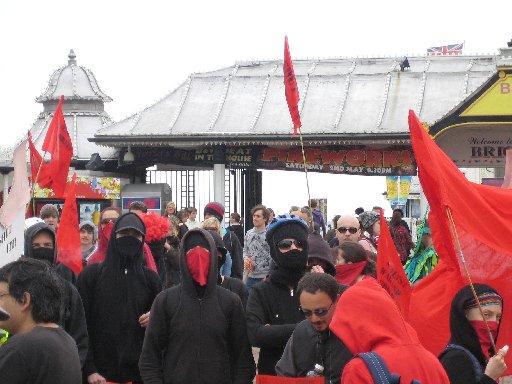 Masked demonstrators congregate outside the Sealife Centre.