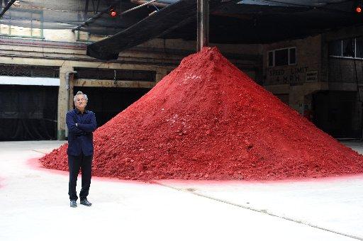 Anish Kapoor with his sculpture the Dismemberment of Jeanne D'Arc at the Old Municipal Market.
