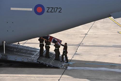Guardsman Brackpool's coffin is returned to the UK.