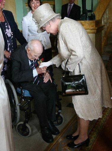 Queen Elizabeth II meeting former first World War veteran Henry Allingham on July 10, 2007.