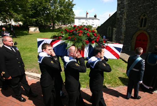 The coffin is carried into St. Nicholas' Church in Brighton, East Sussex, during the funeral of WWI veteran Henry Allingham. Picture by Gareth Fuller/PA Wire.