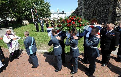 The Last Post is played for Henry Allingham at his funeral today held at the Parish Church of St Nicholas of Myra in Brighton