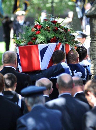 Henry's coffin leaves the church. 