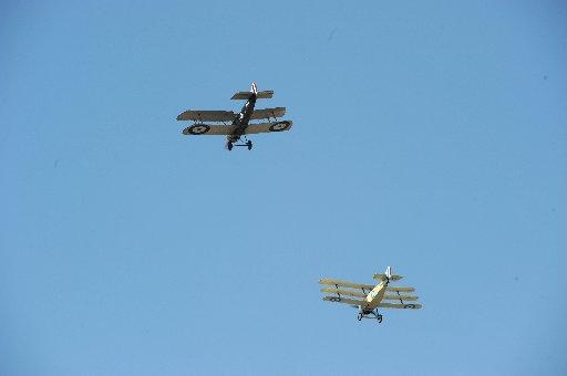 Replica planes from World War1 fly past at the funeral of Henry Allingham.