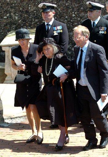 The estranged daughter of Henry Allingham , Betty Hankin (centre) leaves his funeral.