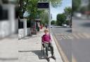 A man from Hove has chained himself to an unactivated bus stop in protest