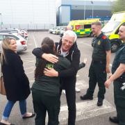 Dave Mortimer hugging Layah Garside who gave Nicky Carr and Steve Grant instructions on how to do chest compressions