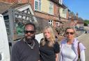 Left to right: The Blacksmiths Arms landlord Jazz Benjamin, with Green Party councillors Joa Saunders and Lucy Agace in front of damaged pub