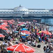 People soaking up the sun on Brighton beach today