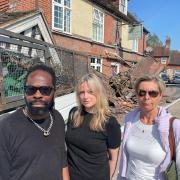 Left to right: The Blacksmiths Arms landlord Jazz Benjamin, with Green Party councillors Joa Saunders and Lucy Agace in front of damaged pub