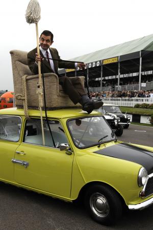 Rowan Atkinson speeds around Goodwood Circuit as Mr Bean