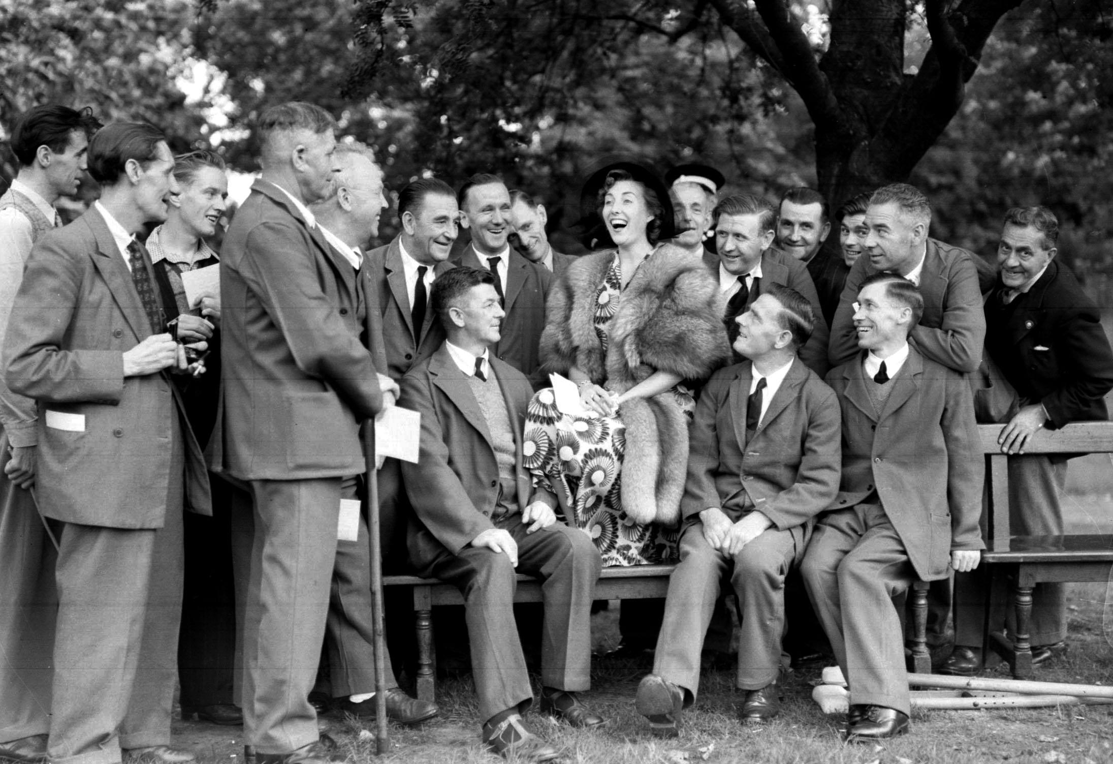 File photo dated 03/08/50 of Vera Lynn with ex-servicemen during a Garden Party held by the Queen at Buckingham Palace, London. Forces sweetheart Dame Vera Lynn has died at the age of 103. PA Photo. Issue date: Thursday June 18, 2020. See PA story DEATH