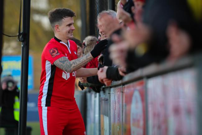 Dean Cox celebrates with Eastbourne Borough fans. Picture by Andy Pelling