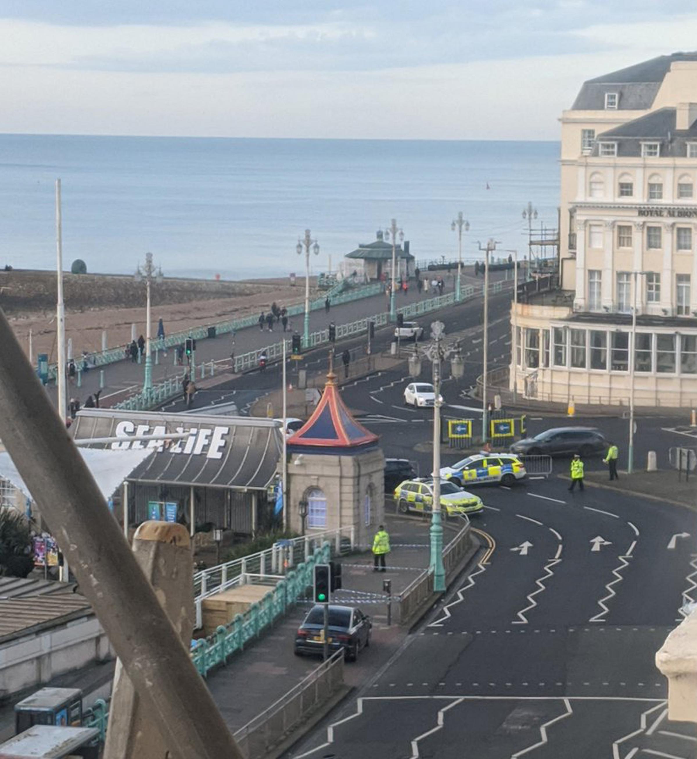 Handout photo taken with permission from the twitter feed of @HLOBlog of police presence at Brighton seafront, where a 32-year-old man has been arrested after a car hit three people during a fight. PA Photo. Issue date: Sunday December 1, 2019. Officers w
