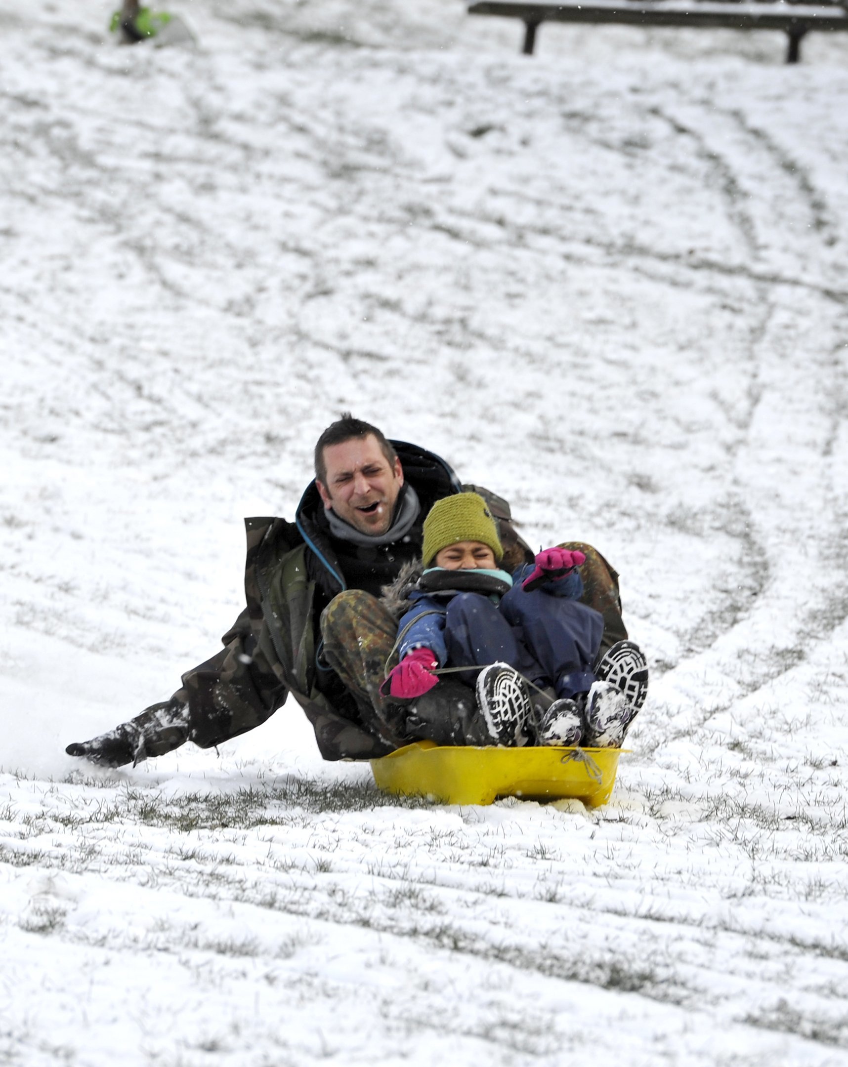Brighton UK 27th February 2018 - Sledging fun in Queens Park Brighton early this morning as the Beast of the East snow storms spread across Britain today with more snow and freezing weather forecast for the rest of the week.Photograph taken by Simon 
