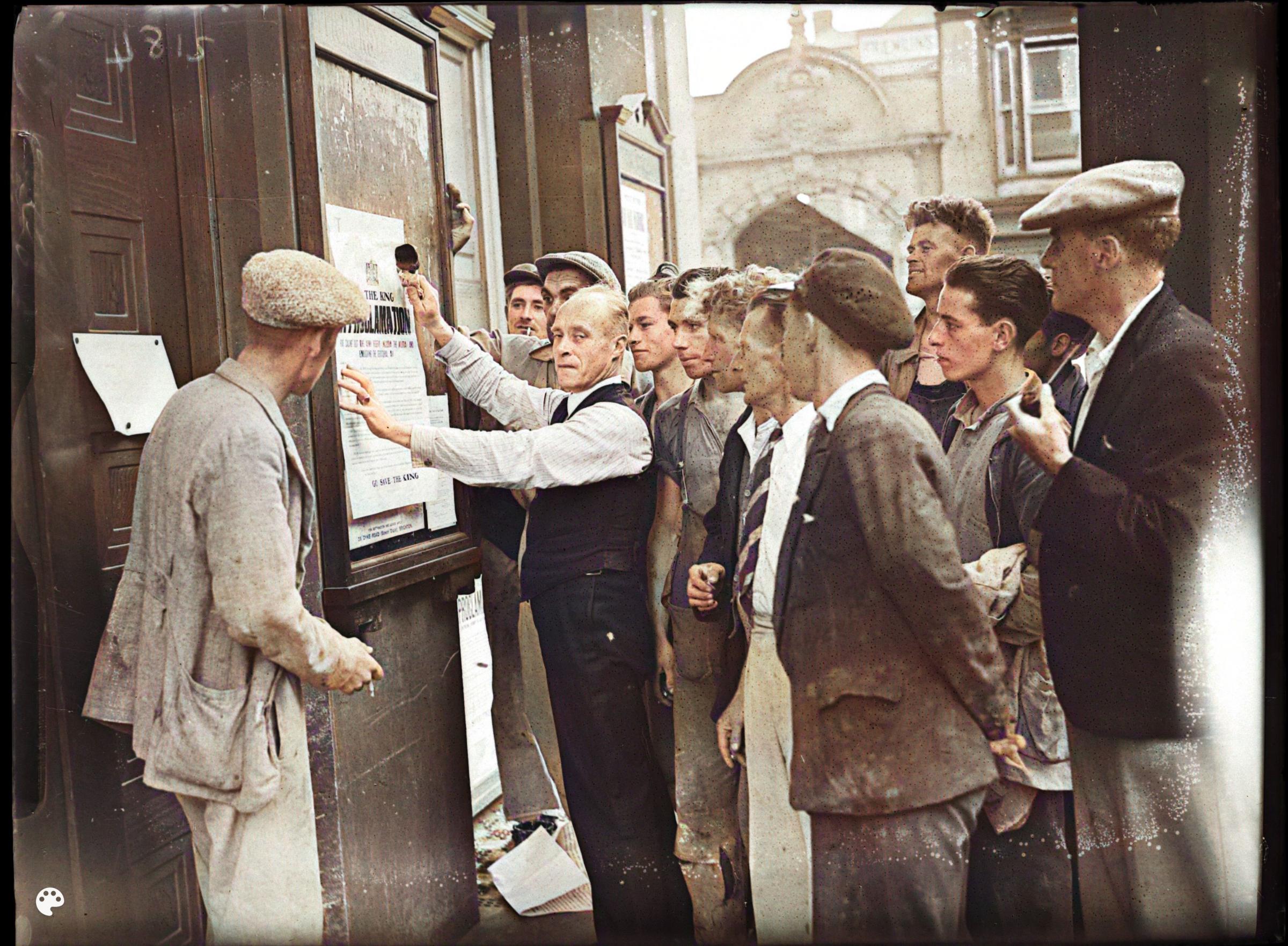 The proclamation of the accession of Edward VIII in January 1936. The notices pasted on the window is headed ‘God Save The King’ 