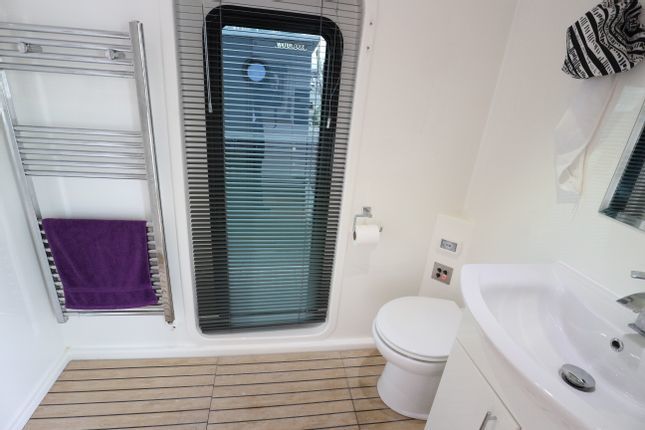 Inside a two-bedroom houseboat for sale at Brighton Marina Credit: Zoopla