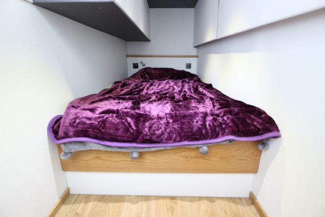 Inside a two-bedroom houseboat for sale at Brighton Marina Credit: Zoopla
