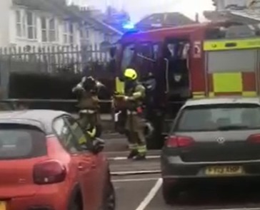 Firefighters worked quickly to extinguish a car fire in the car park of the Tesco superstore in Hove Credit: Chris Simmons eight-year-old daughter Anna