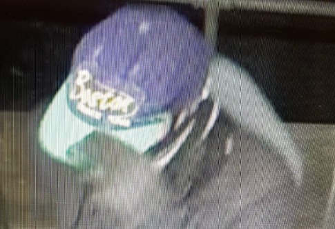 The masked robber in a distincitive purple Boston baseball cap robbed the Co-op store in Framfield Way, Eastbourne