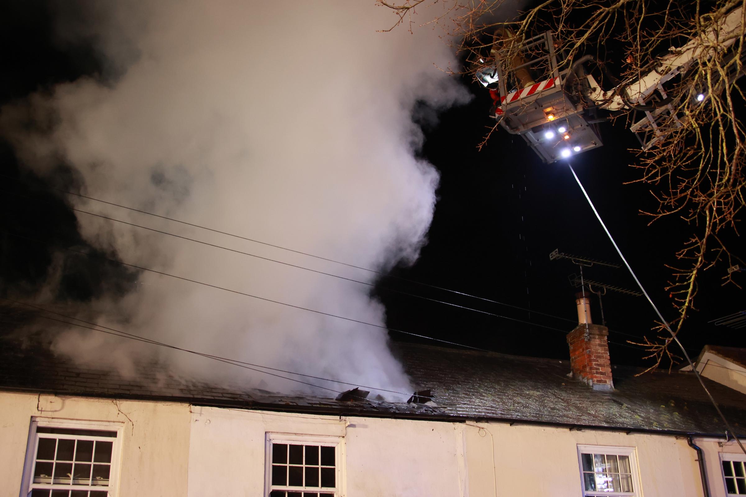Fire tears through roofs of terraced houses in Crossbush, near Arundel Credit: Eddie Mitchell