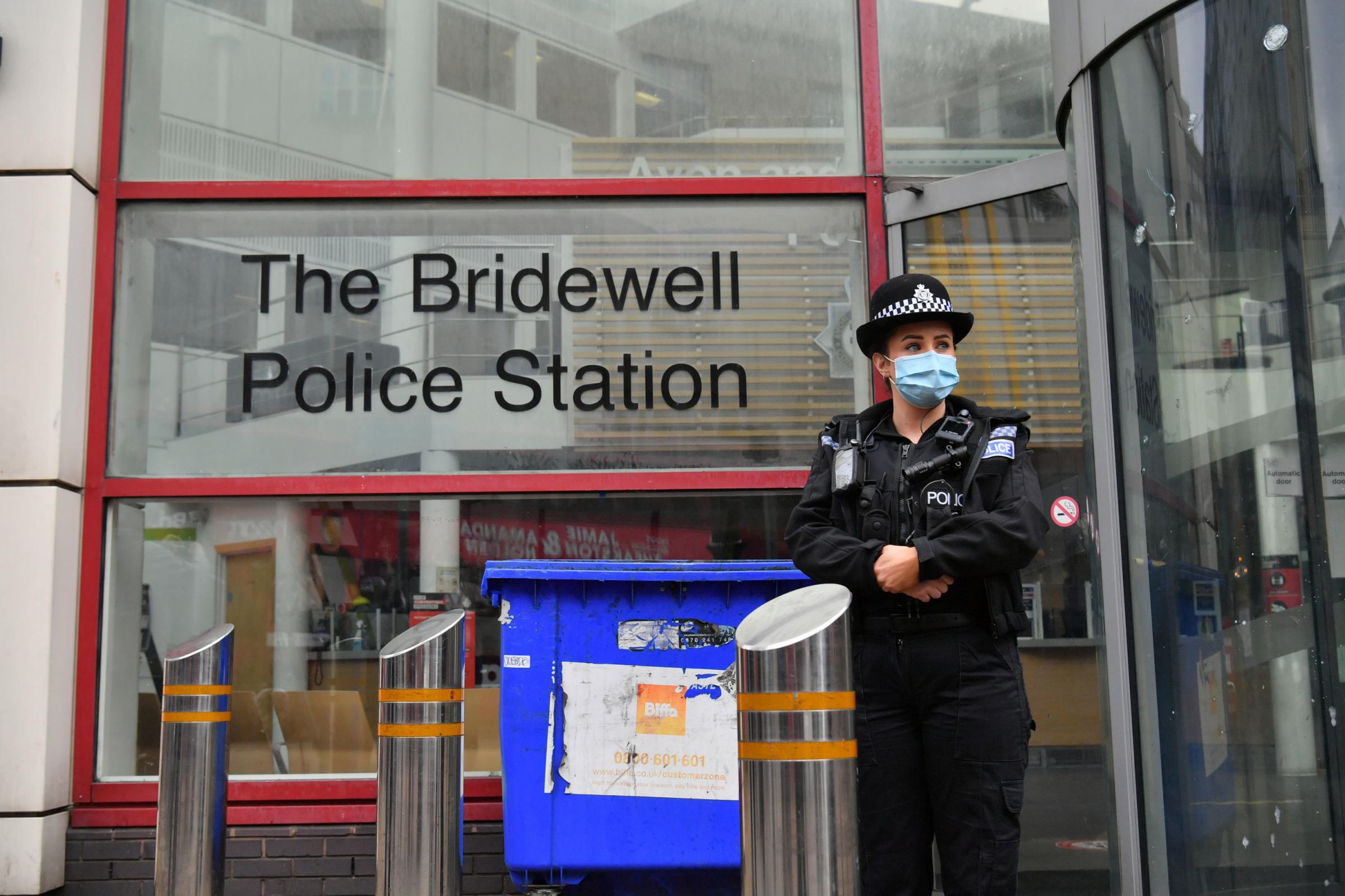 A police officer outside of Bridewell Police Station in Bristol, where protesters broke windows and vandalised the building on Sunday following a demonstration against the Governments controversial Police and Crime Bill. Picture date: Monday March 22,