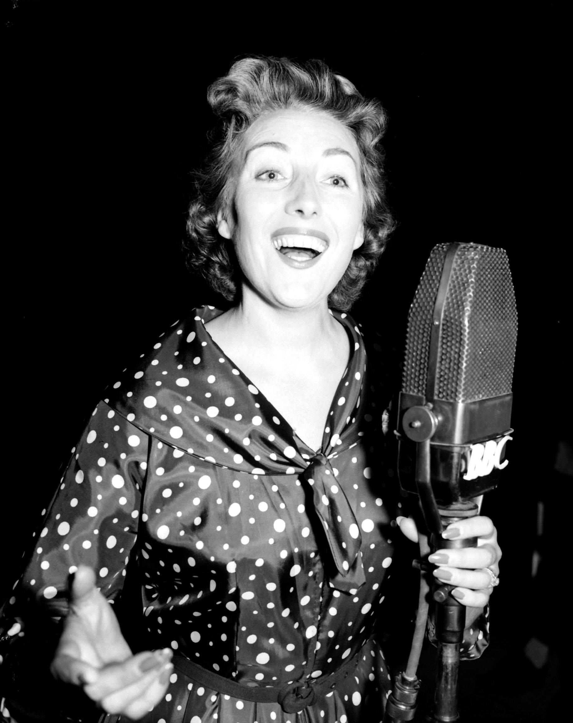 File photo dated 30/07/56 of singer Vera Lynn, rehearsing in London for her new radio show. Dame Vera will be honoured with a Spitfire flypast in her beloved Sussex village before her funeral later on Friday. PA Photo. Issue date: Friday July 10, 2020.