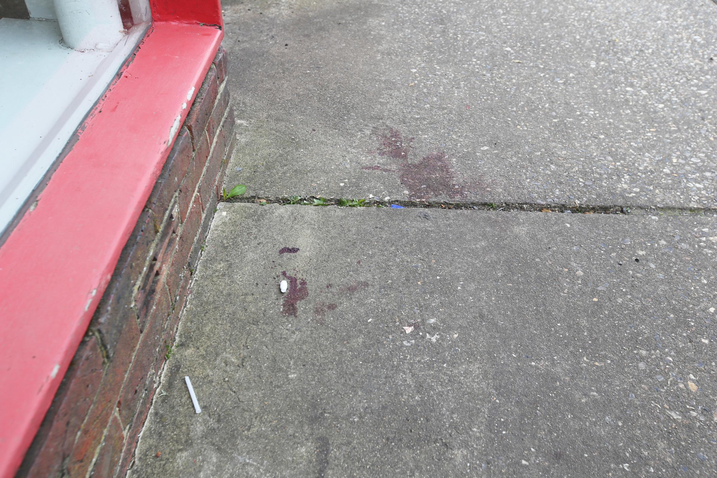 A section of ground where witnesses said there had been a pool of blood after a stabbing near Billingshurst Railway Station