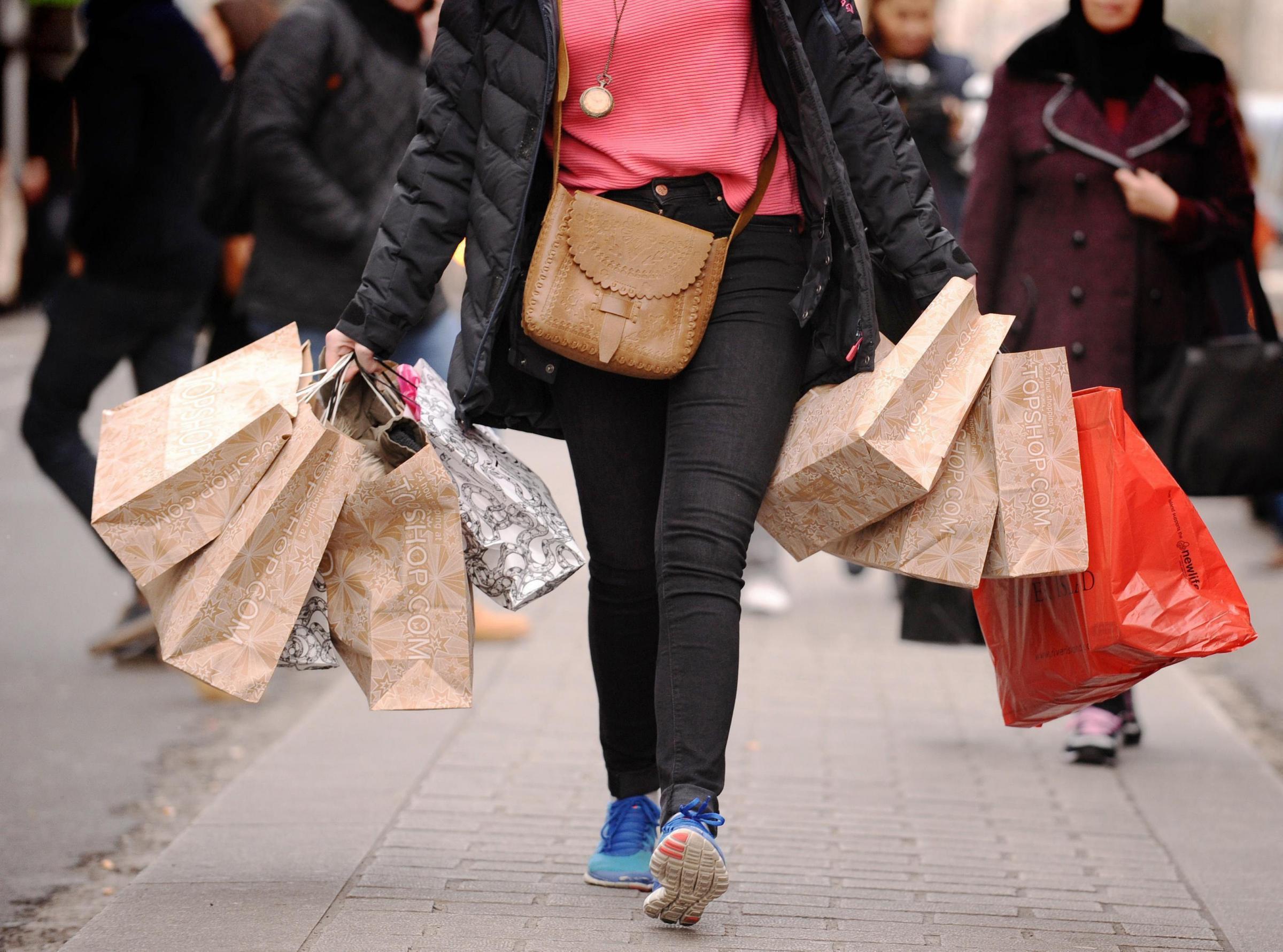 File photo dated 06/12/11 of a person with shopping bags. Retail sales bounced back by a healthy 1% in June in an unexpected boost for the sector, official figures show. PRESS ASSOCIATION Photo. Issue date: Thursday July 18, 2019. Monthly retail sales