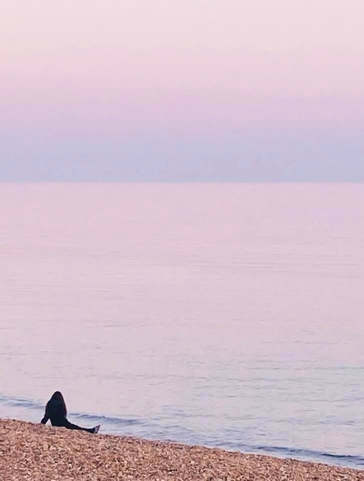 A pensive moment on Brighton beach by Mary Cullen