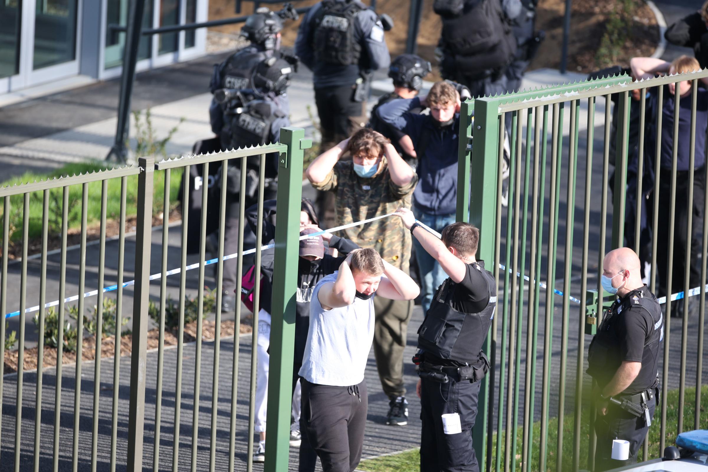 CRAWLEY FIREARMS INCIDENT - STUDENTS LEAVING THE BUILDING WITH HANDS ON THIER HEADS.