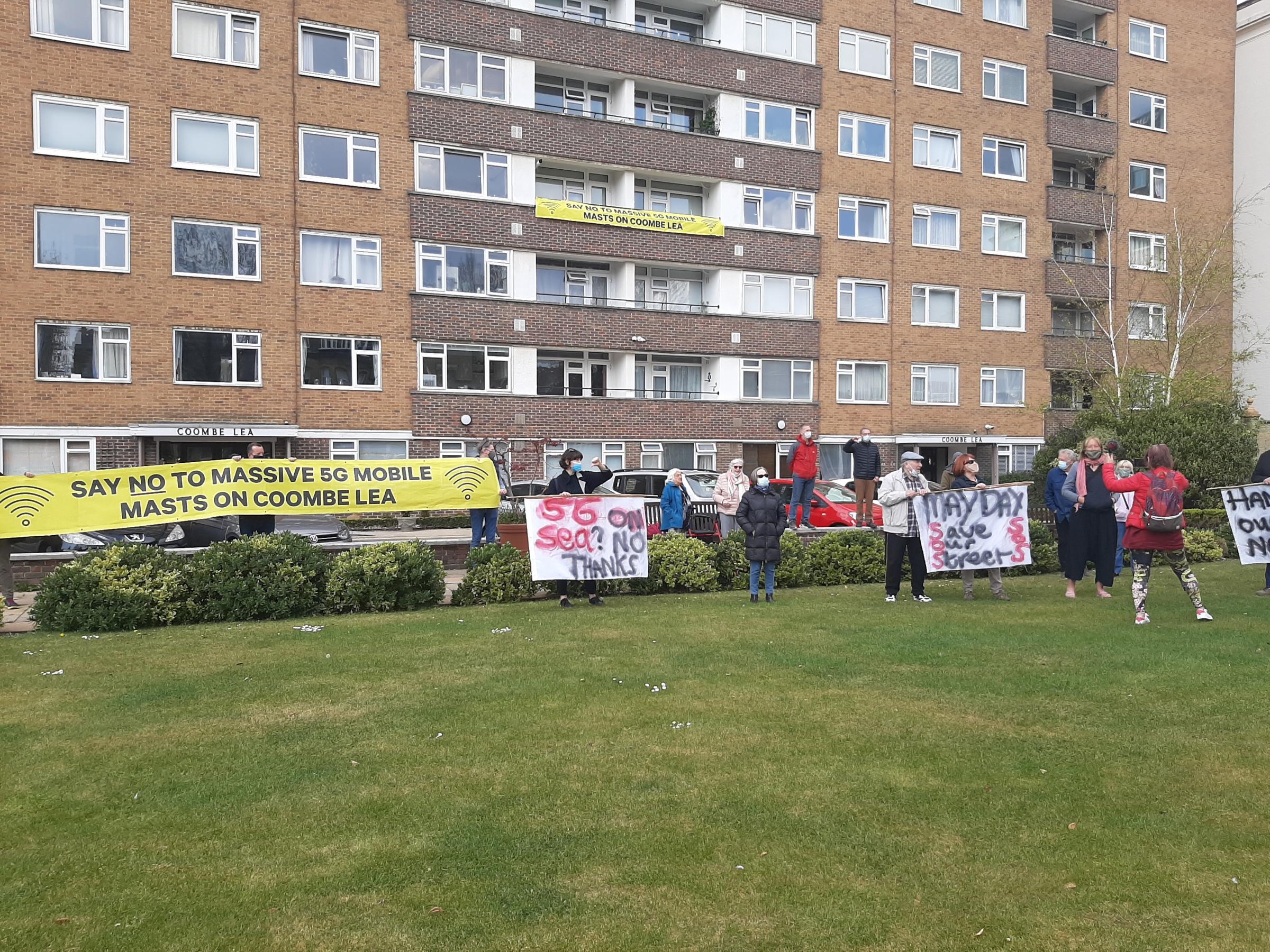 Protesters are angry about plans for six 5G mobile phone masts to be installed on top of the Coombe Lea block of flats in Grand Avenue, Hove