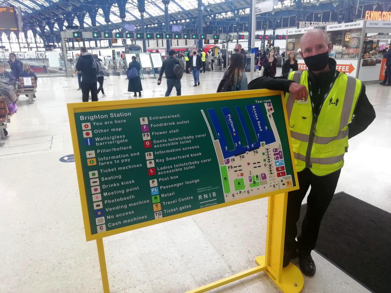 Brighton gateline supervisor Adrian Davis and the new tactile map