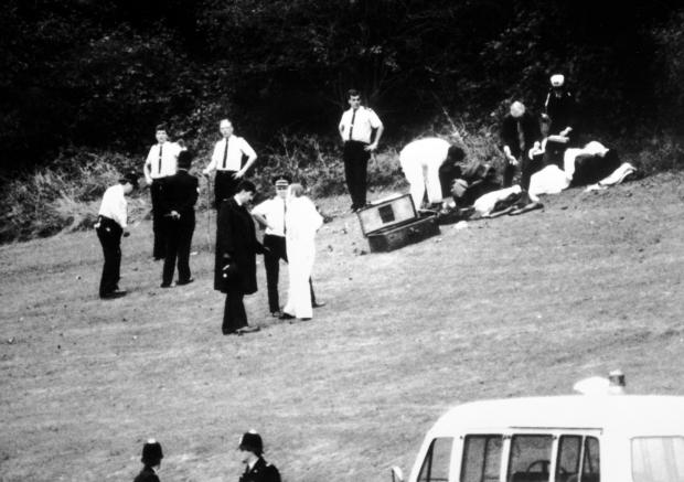 The Argus: File photo dated 11/10/86 of forensic experts preparing to go into the wood where the bodies of Nicola and Karen were found 