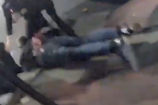 Footage shows Cunningham lying on the ground under arrest
