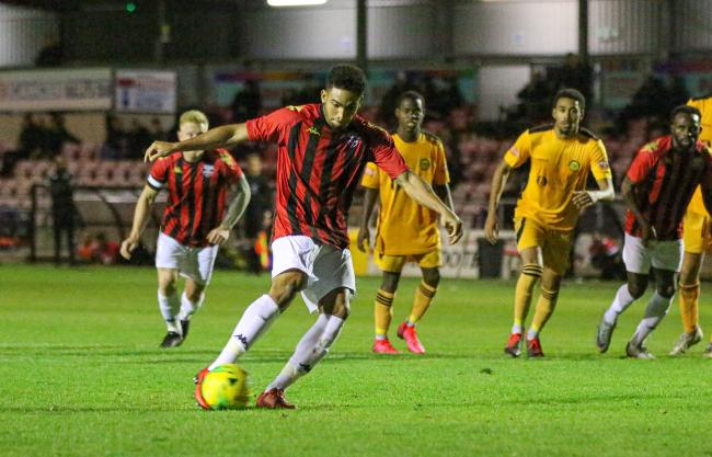 Aaron Cosgrove scoring from the spot for Lewes in their 1-0 win over Merstham at the Dripping Pan last season. Picture: James Boyes