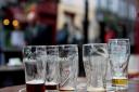 File photo dated 24/10/13 of empty pint glasses outside a bar as workers should be screened for alcohol misuse, according to an article in a leading medical journal. PRESS ASSOCIATION Photo. Issue date: Friday November 8, 2013. Employees should take a sta