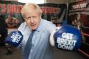 Prime Minister Boris Johnson during a visit to Jimmy Egan's Boxing Academy at Wythenshawe, while on the campaign trail ahead of the General Election. PA Photo. Picture date: Tuesday November 19, 2019. See PA story POLITICS Election. Photo credit shoul