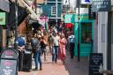 Shoppers stroll through Kensington Gardens in the trendy North Laine area