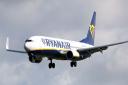 Ryanair passengers barred from flights unless they return Covid refunds. (PA)